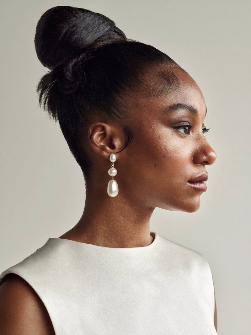 Bride with a smooth high ballerina bun and a clean hairline