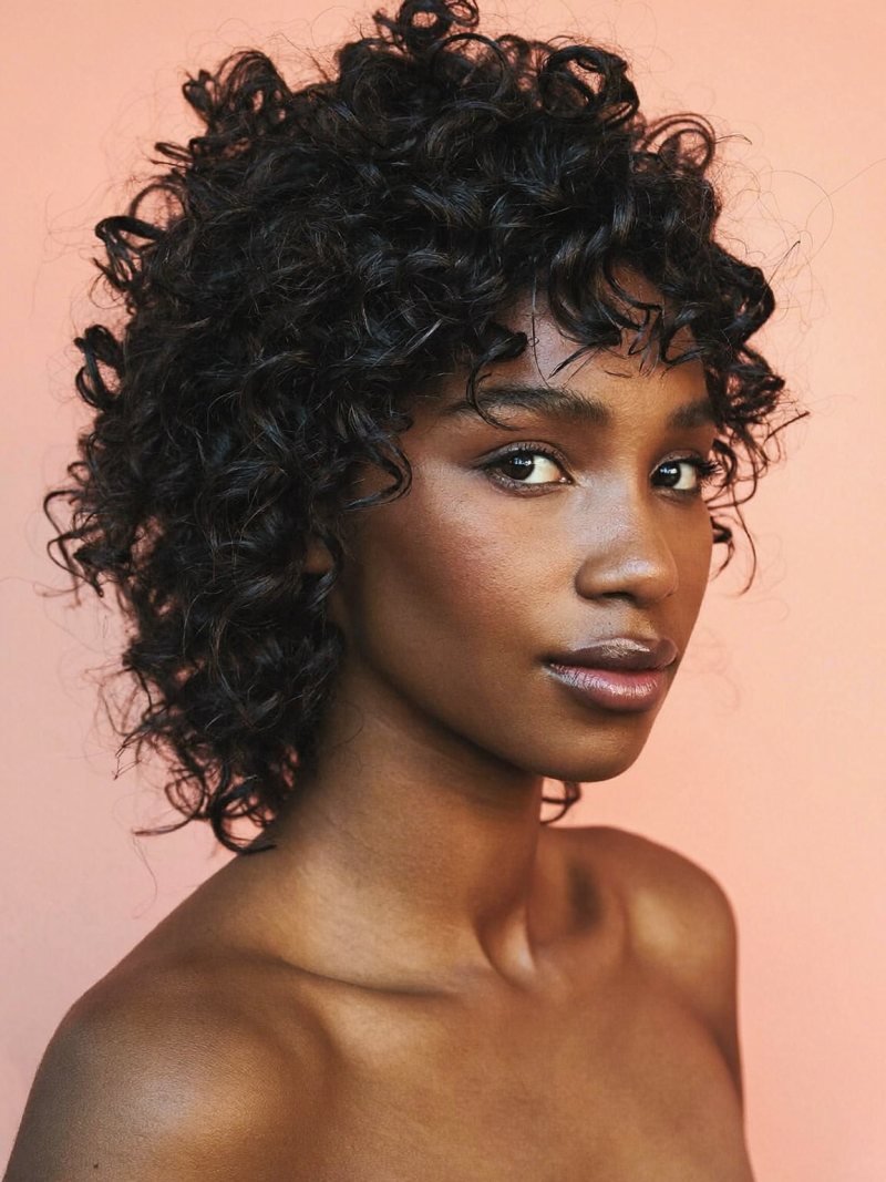 Curly pixie with curls left longer on top