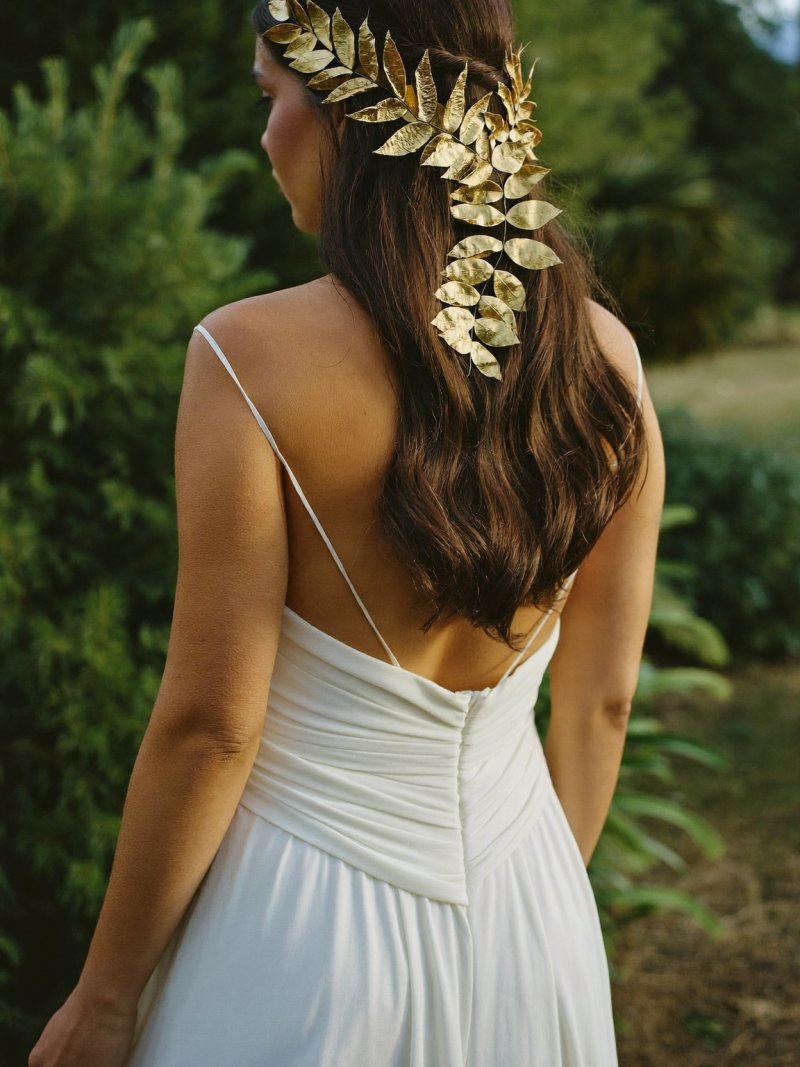 Long dark waves with a gold leaf hair vine across the back