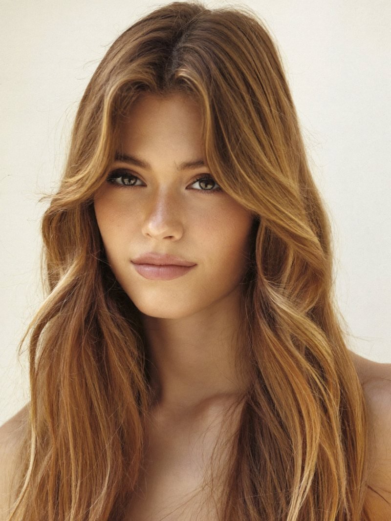 Long hair with curtain bangs parted in the middle