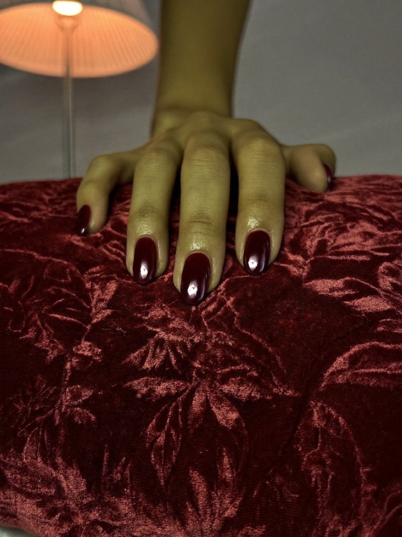 Medium almond nails in burgundy chrome