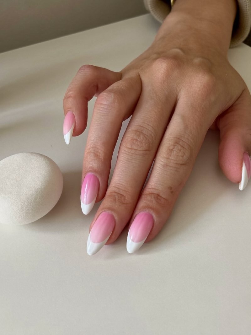 Medium almond nails with a pink to white sponge gradient