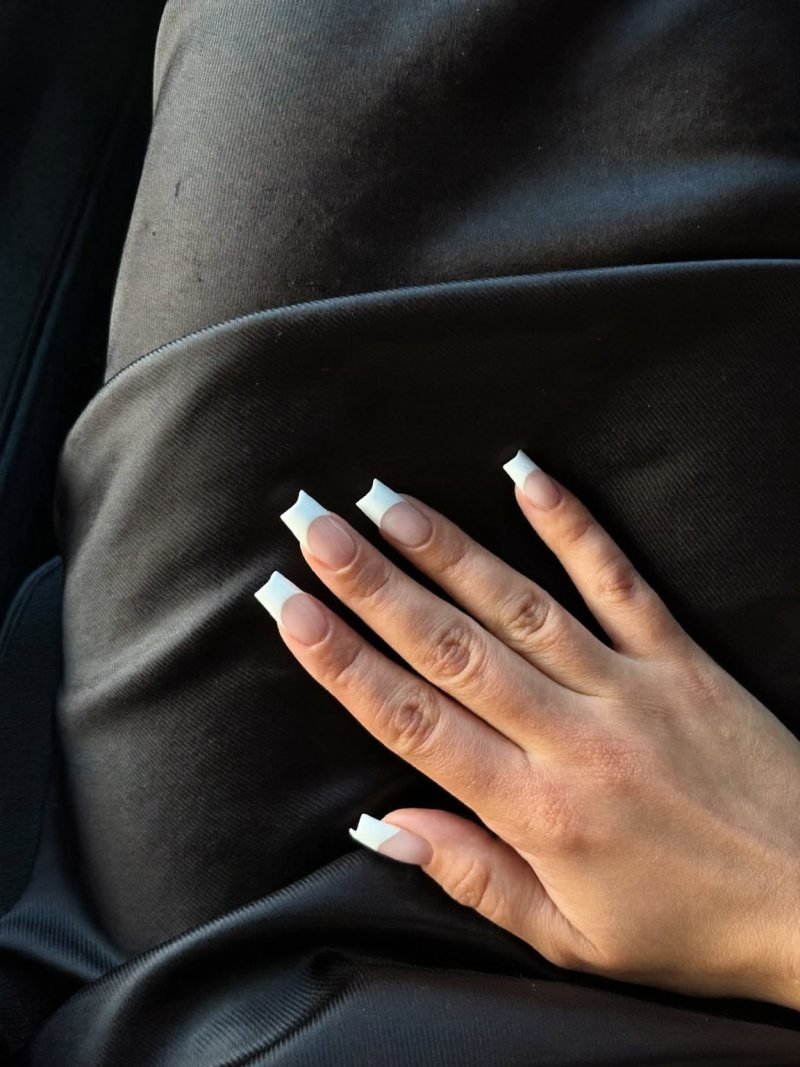 Medium square French manicure with a black dress