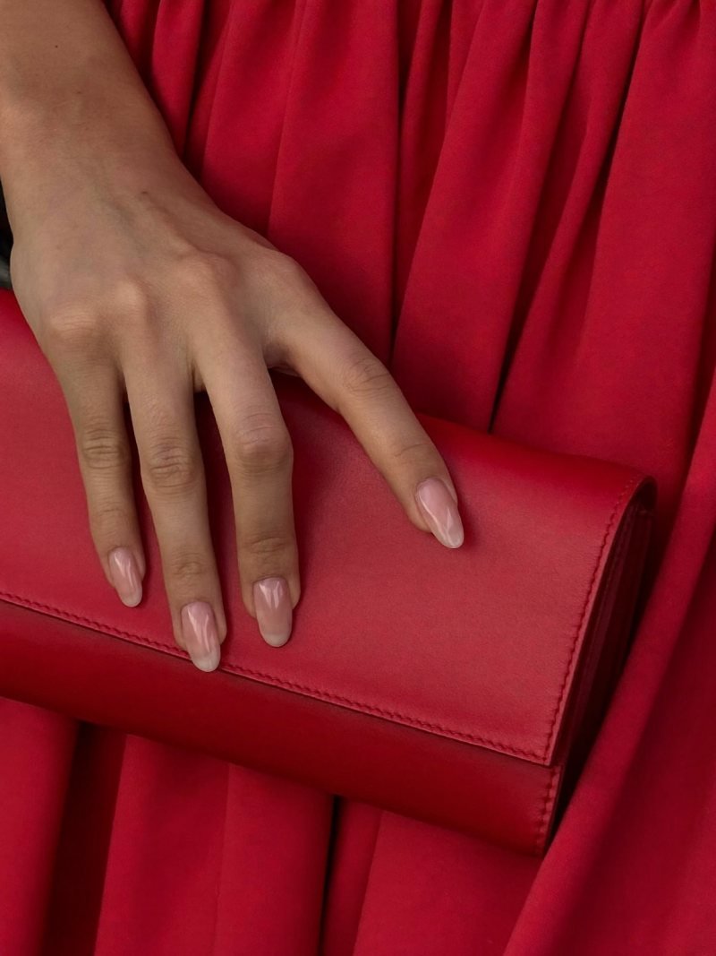 Nude almond nails that go with a red dress
