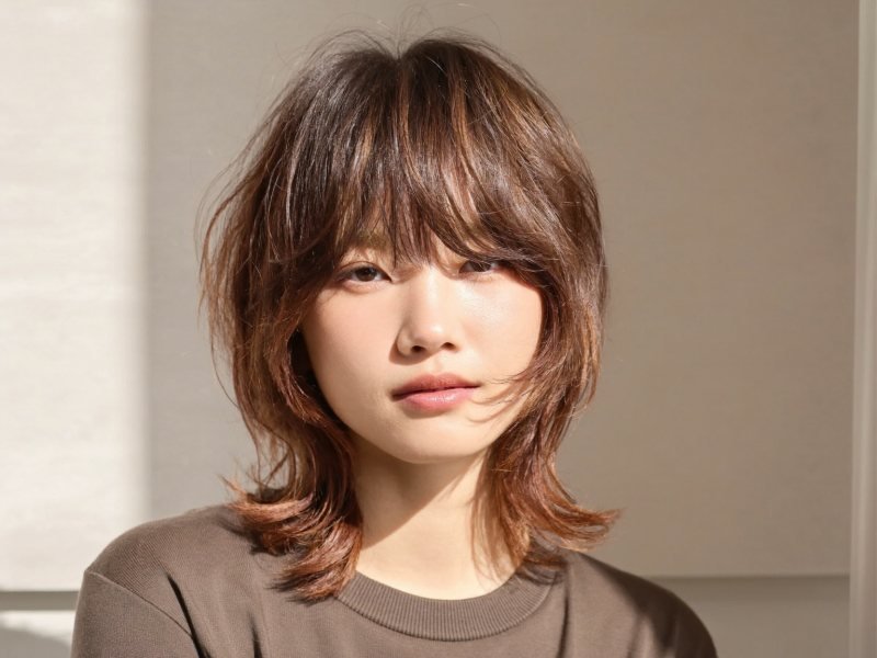 Shag haircut with layers and curtain bangs