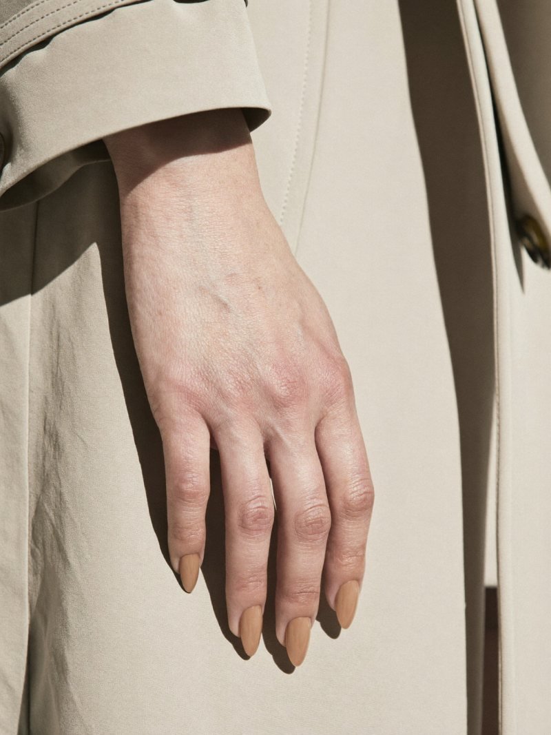 Short almond nails in a sheer caramel nude