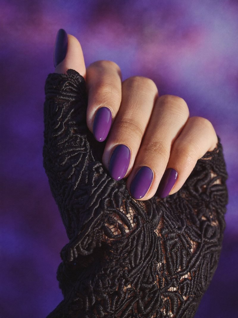 Short almond nails in glossy deep purple