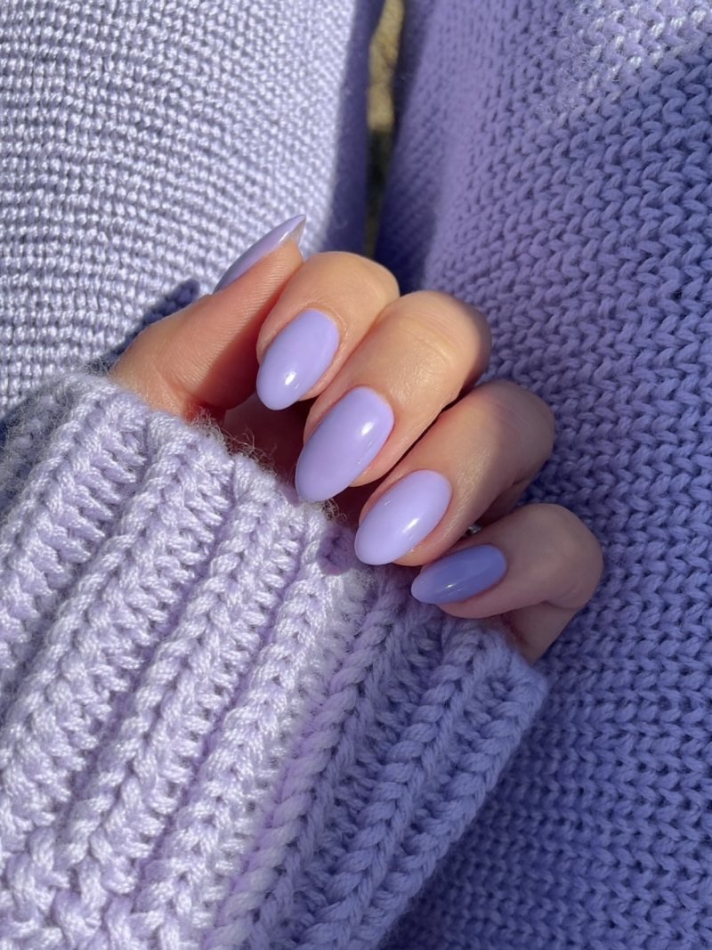 Short almond nails in glossy lilac