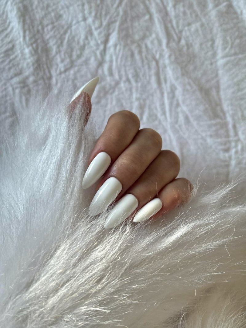 Short almond nails in sheer milky white for winter