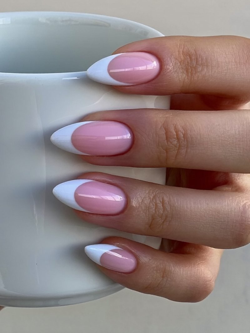 Short almond nails with a hairline white French tip