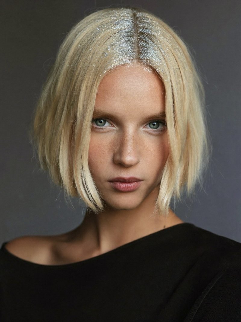 Short blonde bob with silver glitter along the parting