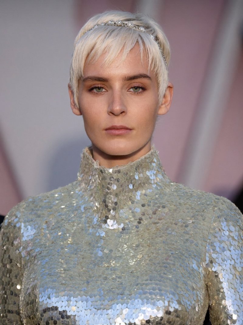Short blonde pixie cut worn with a thin jeweled headband