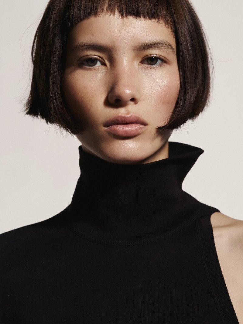 Short dark bob with very short micro bangs above the eyebrows