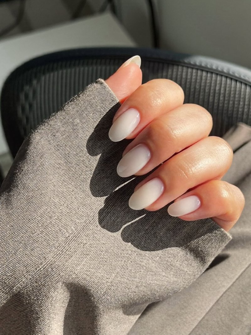 Short oval gel nails in milky white