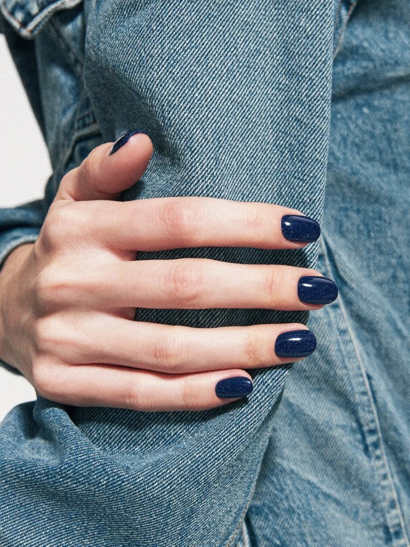 Short oval nails in glossy dark navy blue