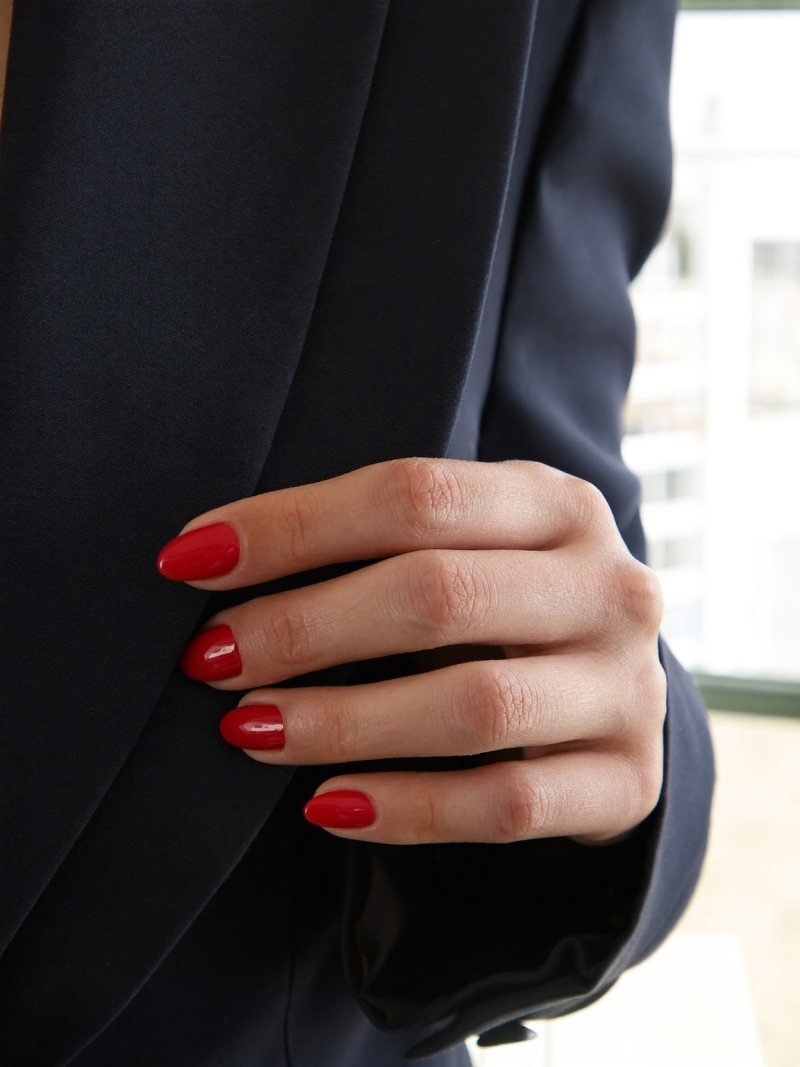 Short round gel nails in classic red