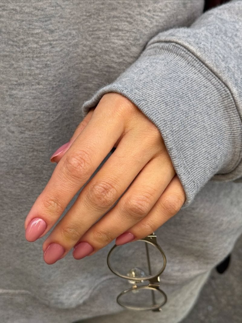 Short round nails in glossy dusty rose pink