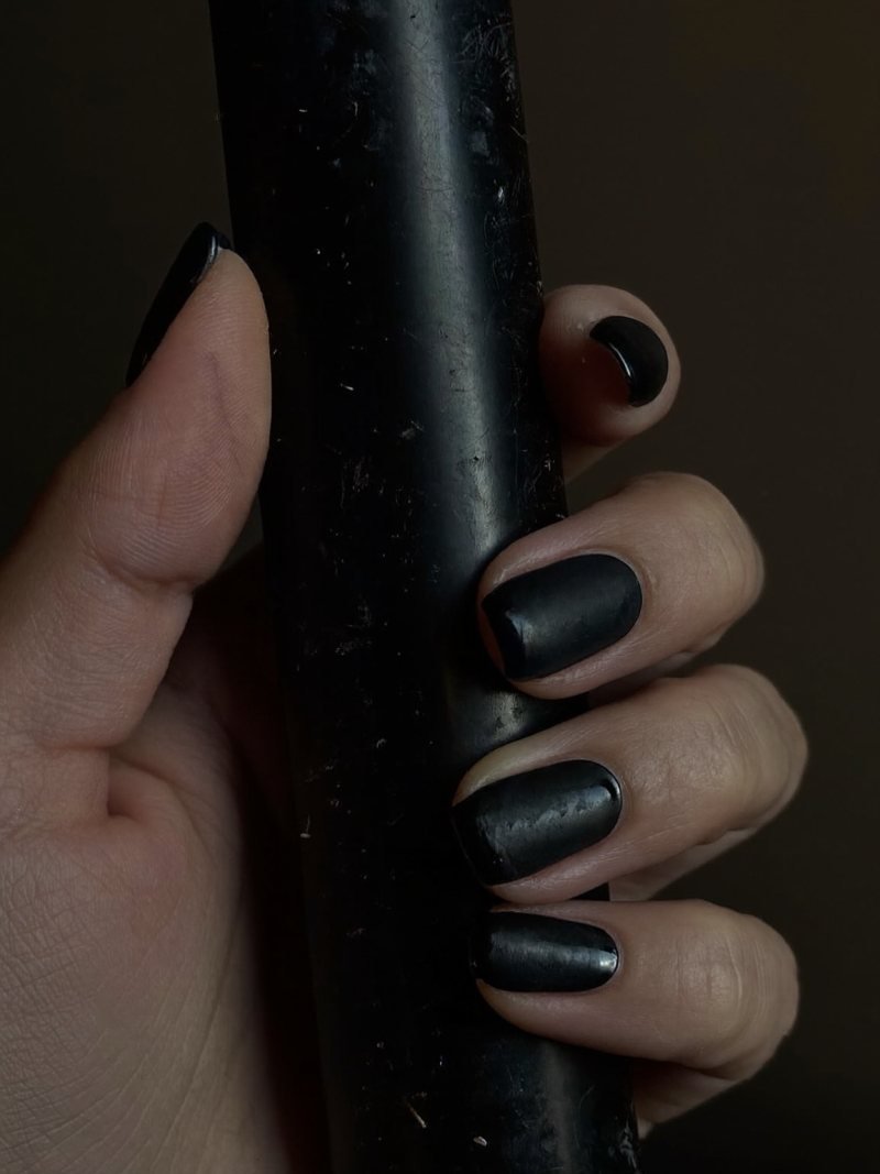 Short square matte black nails with glossy black French tips