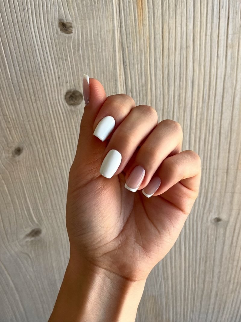 Short square nails split diagonally in nude and white