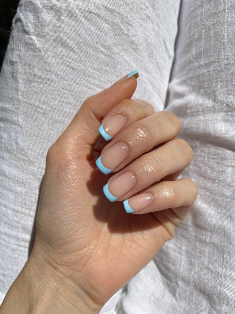 Short square nails with pastel blue French tips
