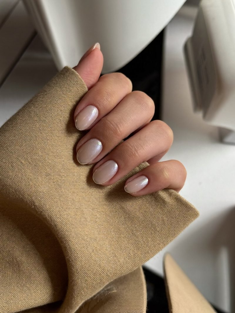 Short squoval nude nails with a subtle glaze