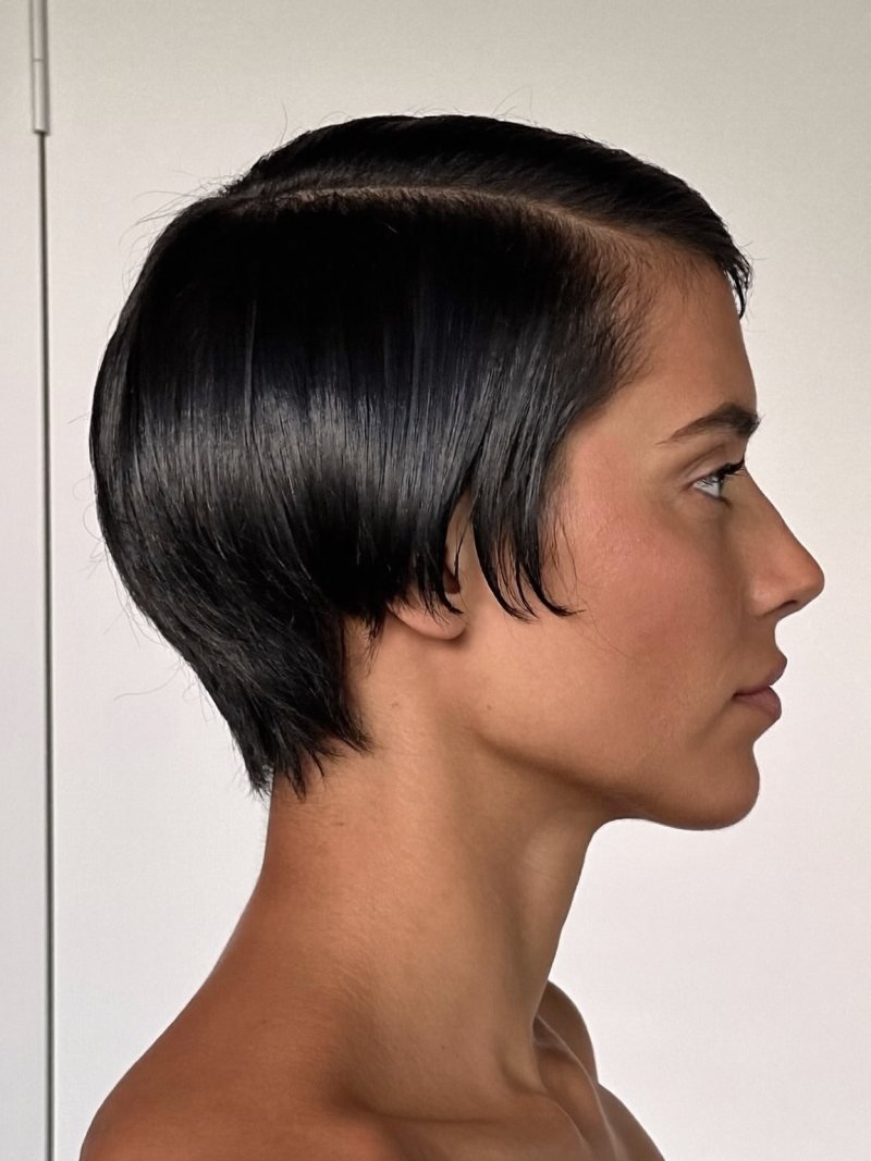 Sleek side-parted pixie with a smooth finish