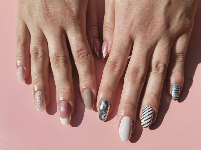 Types of nail designs shown on ten nails, each with a different style