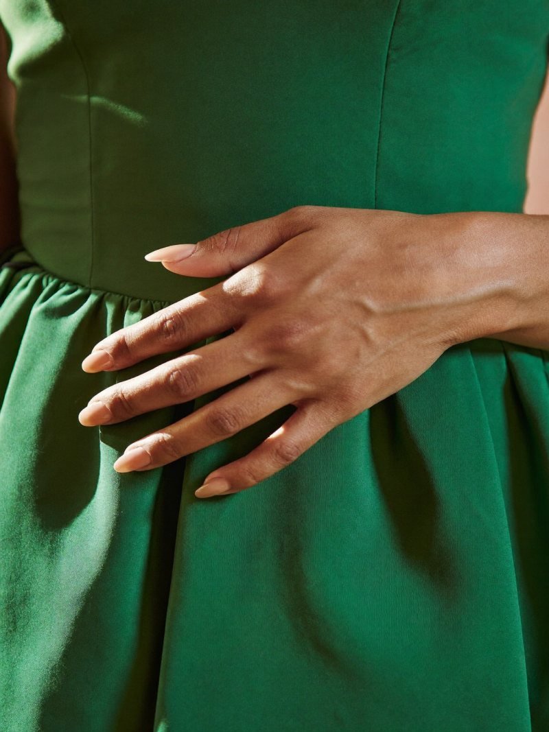 Warm nude nails for a green dress, medium almond
